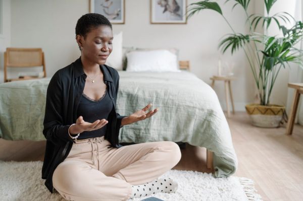 asian woman meditating in a yoga studio