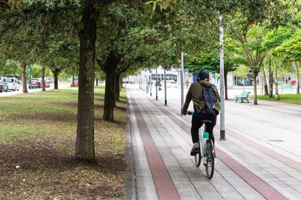 Citizen with public electric bicycle