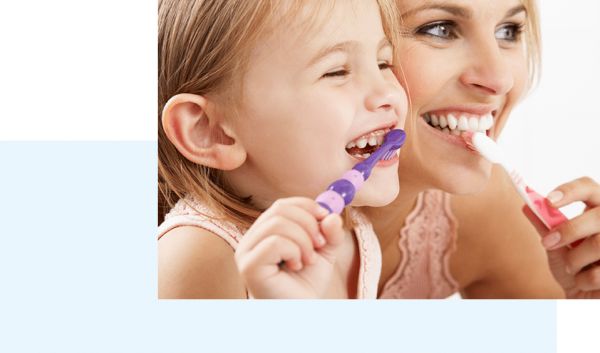 mother and daughter brushing teeth