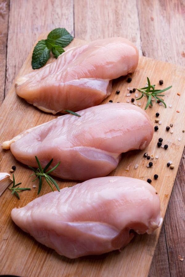 fresh chicken meat chicken fillet with spices on wooden table