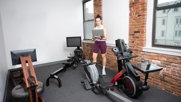 A woman testing rowing machines