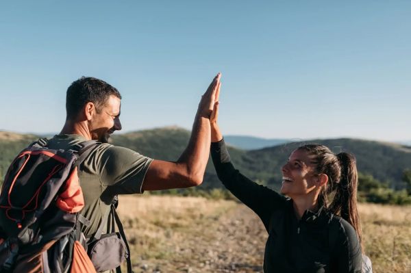young-couple-giving-high-five-improving-health-and-wellbeing