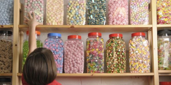 child in sweet shop