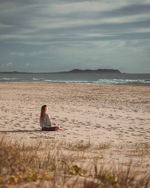 Woman sitting on a beach