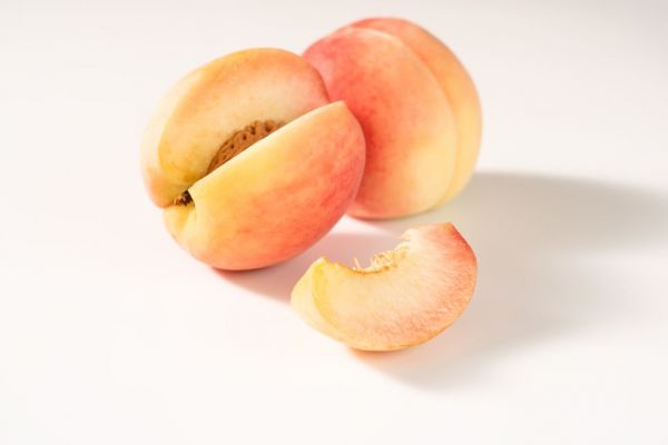 close up of fruit against white background