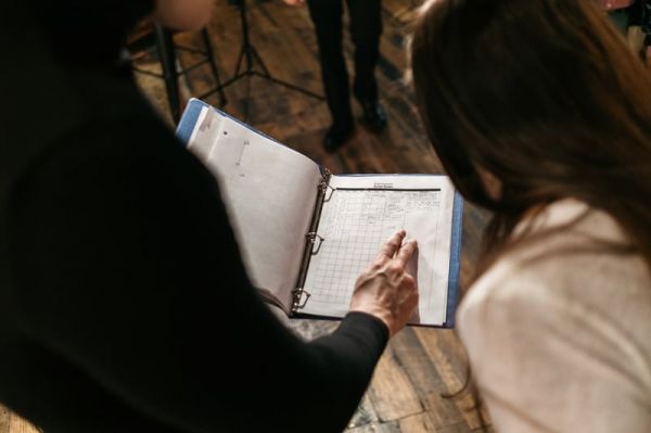 man-and-woman-reviewing-notes-wellness-coaching