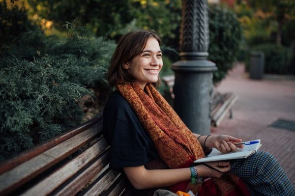 young-woman-writes-in-her-journal-wellness-coaching