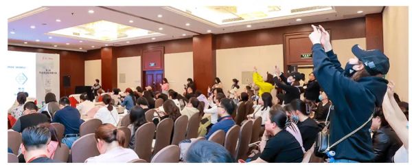 audience engaging in a presentation or event