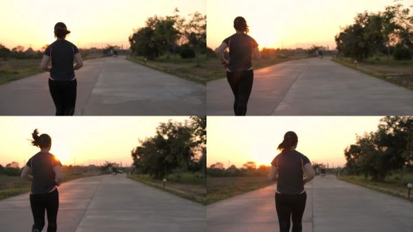 健康女性通过跑步锻炼。