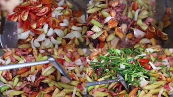 延時攝影：炒制的糖醋豬肉塊與西紅柿、黃瓜混合。