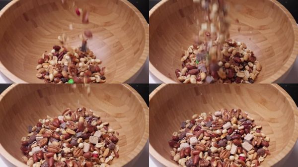 非常近距離特寫：一碗鹽味健康零食的混合物，慢動作拍攝。