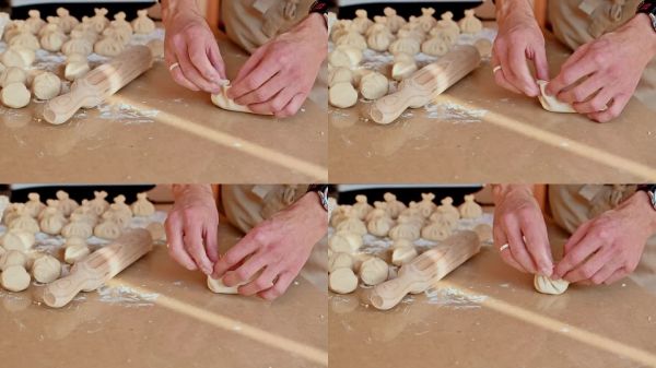 男人正在用面粉和搟面杖準(zhǔn)備傳統(tǒng)自制的格魯吉亞餃子。