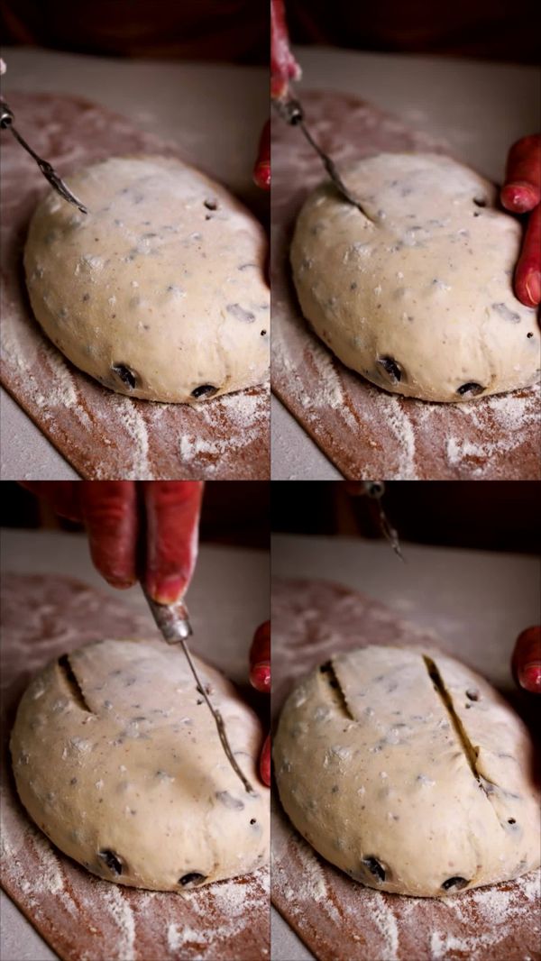 面包師用剃刀刀片塑形發(fā)酵生面團。