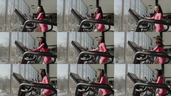 女性在健身房使用橢圓機(jī)鍛煉，提升健康、健身和幸福感。