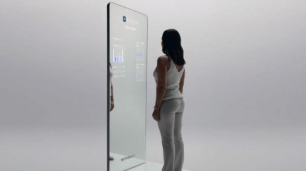 Person stepping onto a mirror scanner and scale