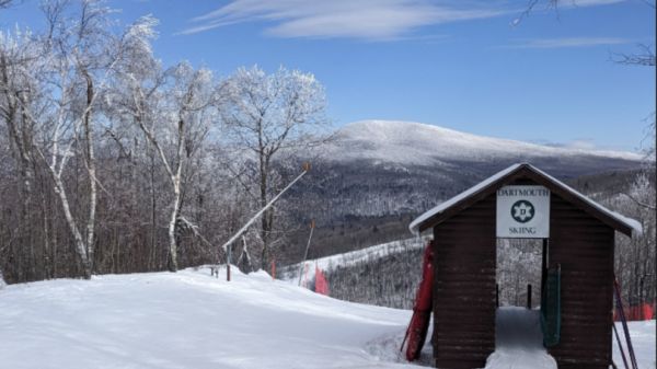 red cabin on a snowcovered overlook