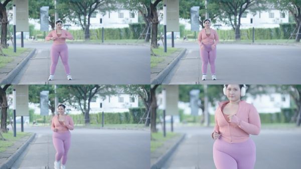 超重年轻女性在城市篮球场上跑步锻炼，参加减肥挑战。