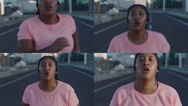 超重女跑步者锻炼跑步减肥挑战休息疲惫看着镜头在城市夕阳